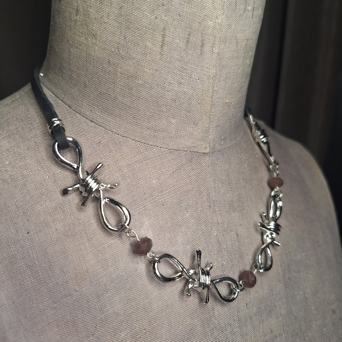 Silver Barbed Wire Necklace with purple crystals and leather ribbon. Handmade.