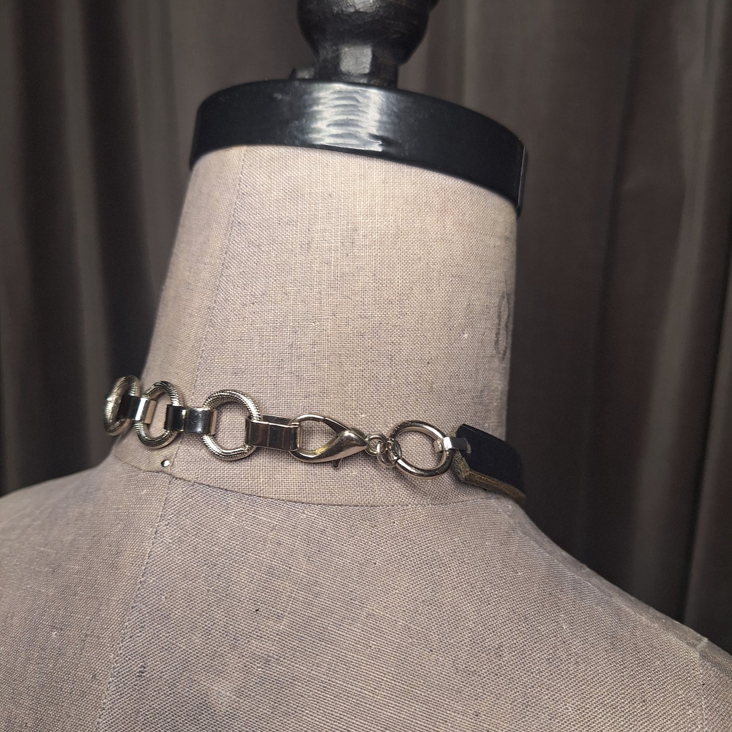 Jewel shaped rosebud pendant with a 2" black steel O-ring, statement necklace. Handmade. High end gothic style. Edgy victorian.