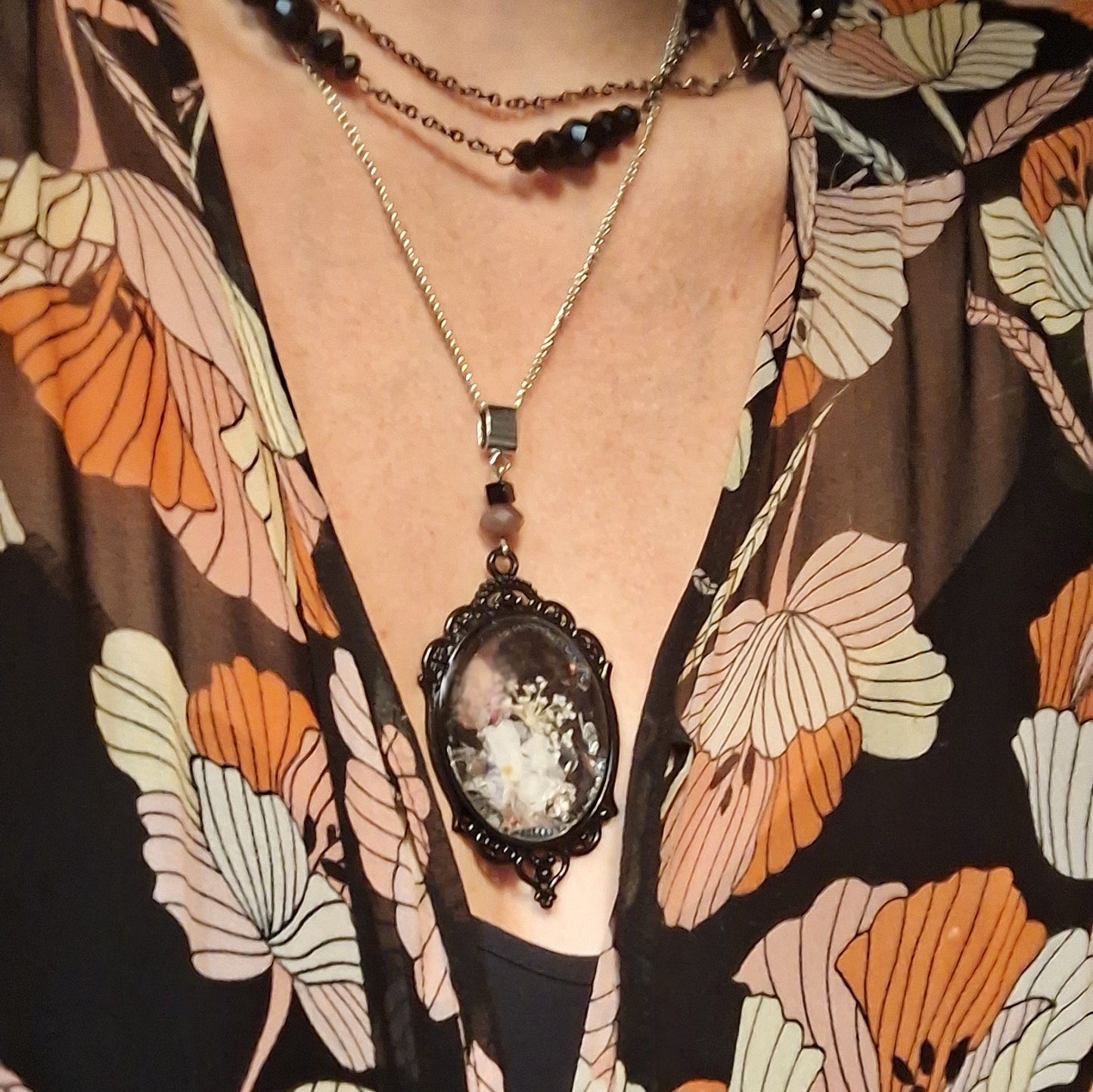 Persephone. Kinda dead, kinda alive. Statement pendant with real pressed flowers. One-of-a-kind.