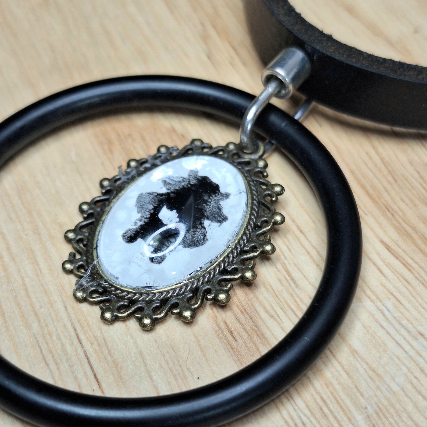 The Watchman Ink Blot Choker. Mix finishes. Antique frame, black steel O-ring.