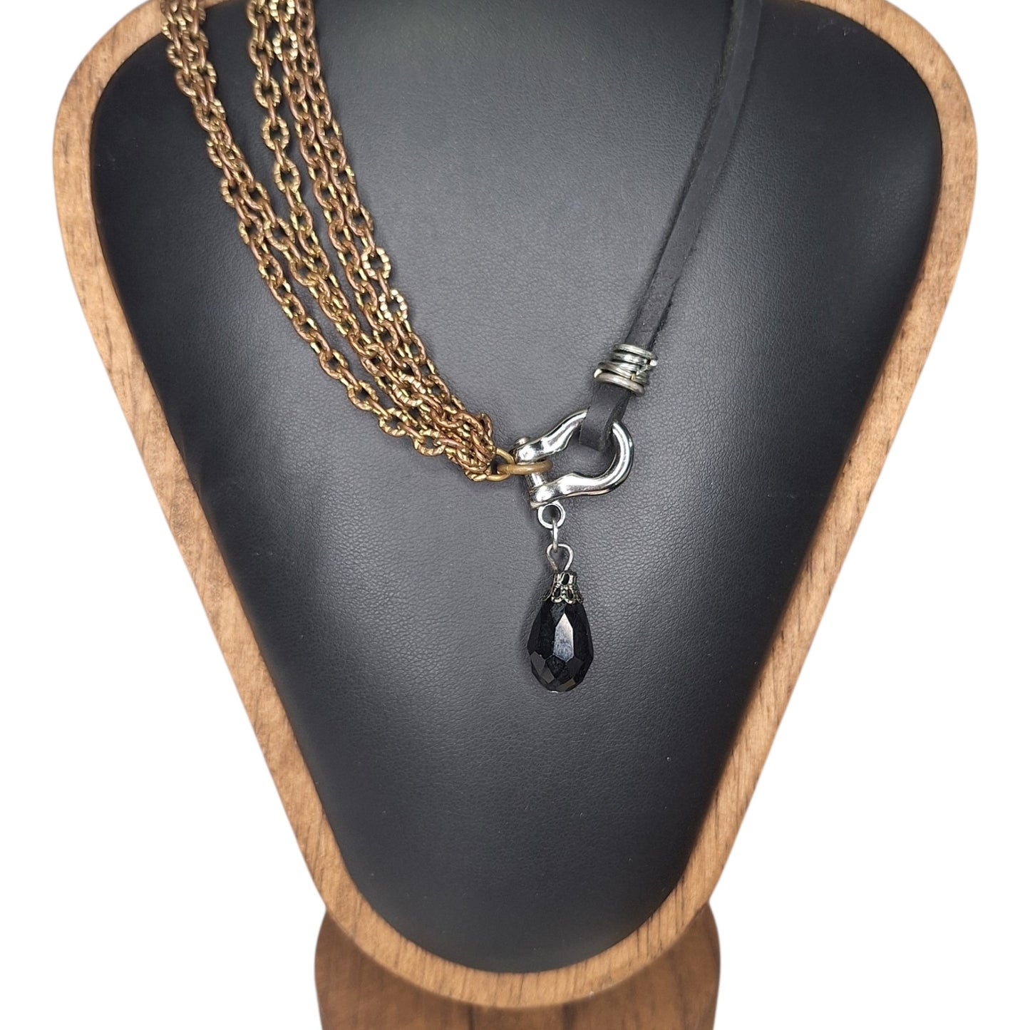 Leather and multi copper chain asymmetrical necklace. Mini silver carabiner with black teardrop crystal.
