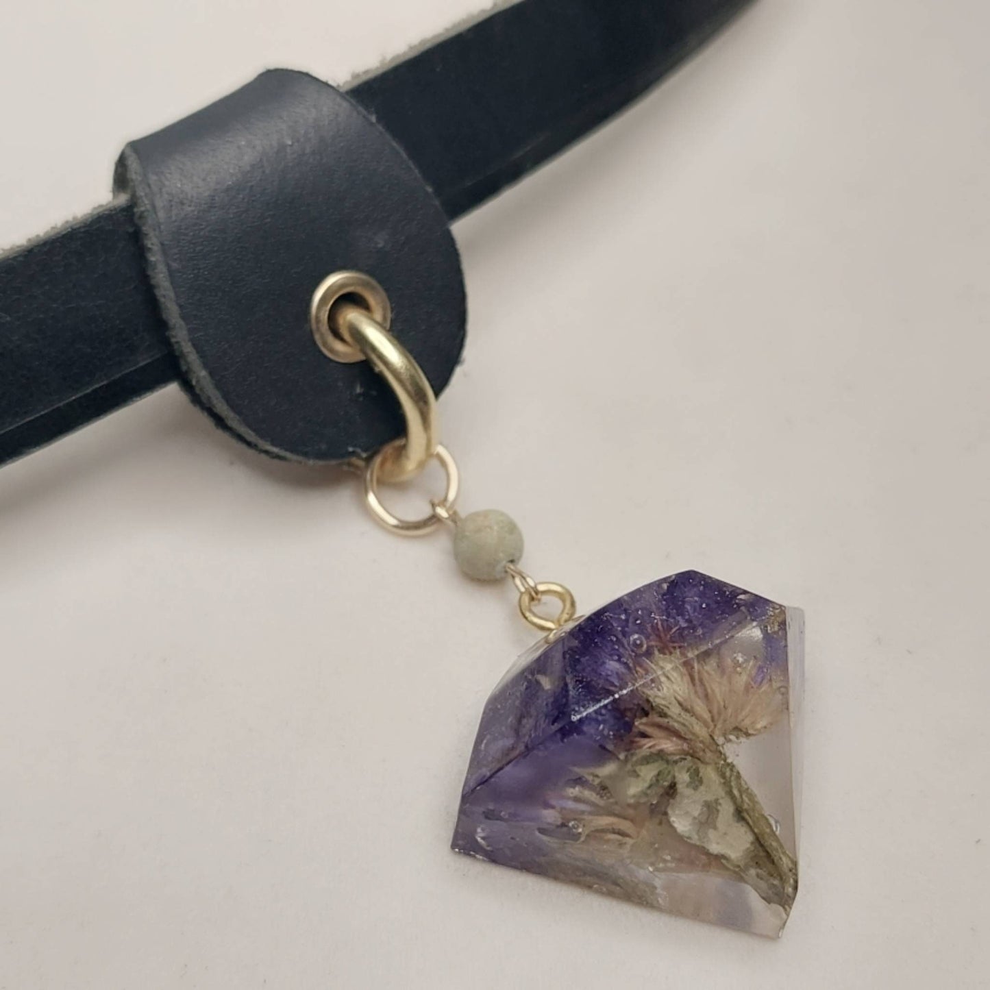 The Shannon Collar. Chic black leather with a slide on jewel shaped purple flower in resin. Handmade.