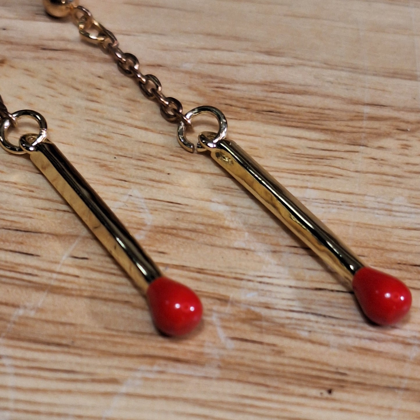 Strike it up. Gold matchstick post earrings.