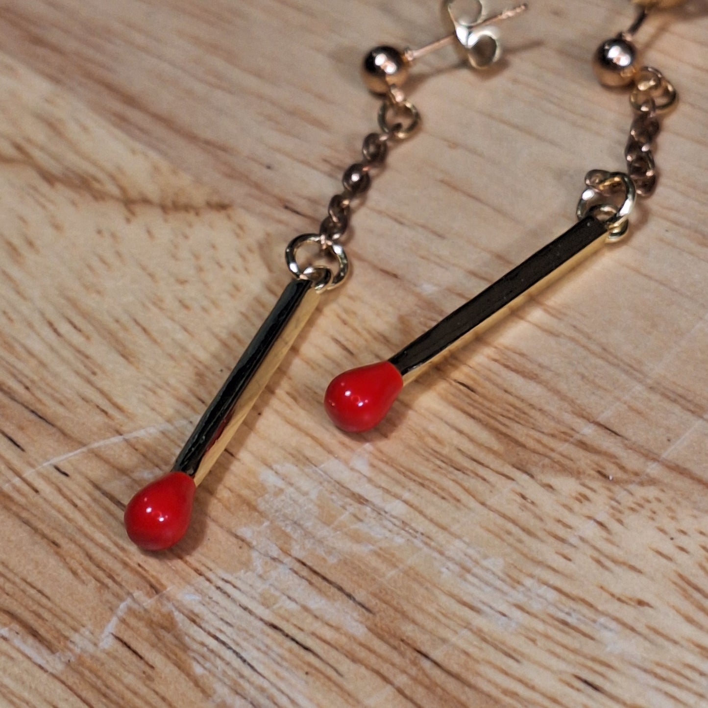 Strike it up. Gold matchstick post earrings.