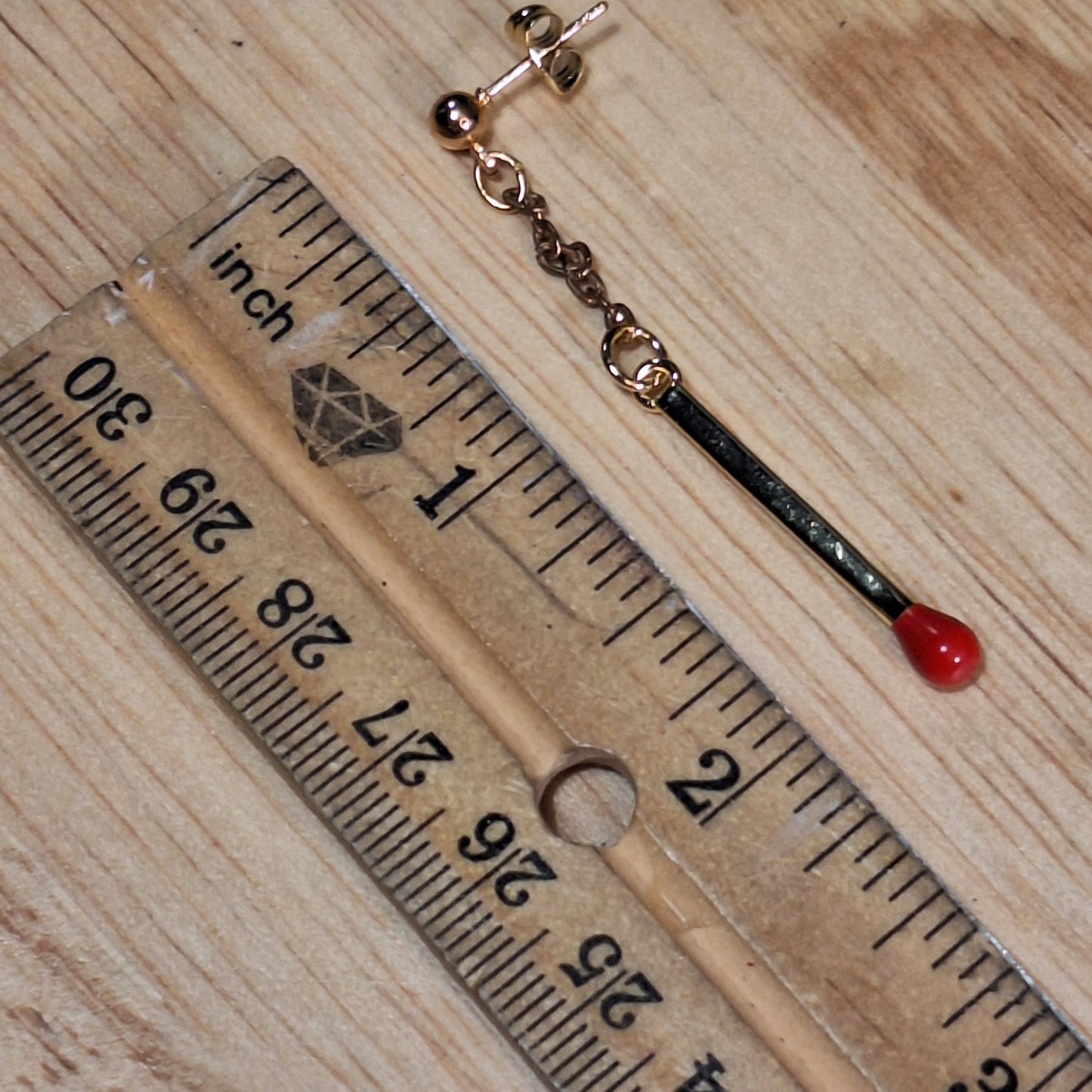 Strike it up. Gold matchstick post earrings.