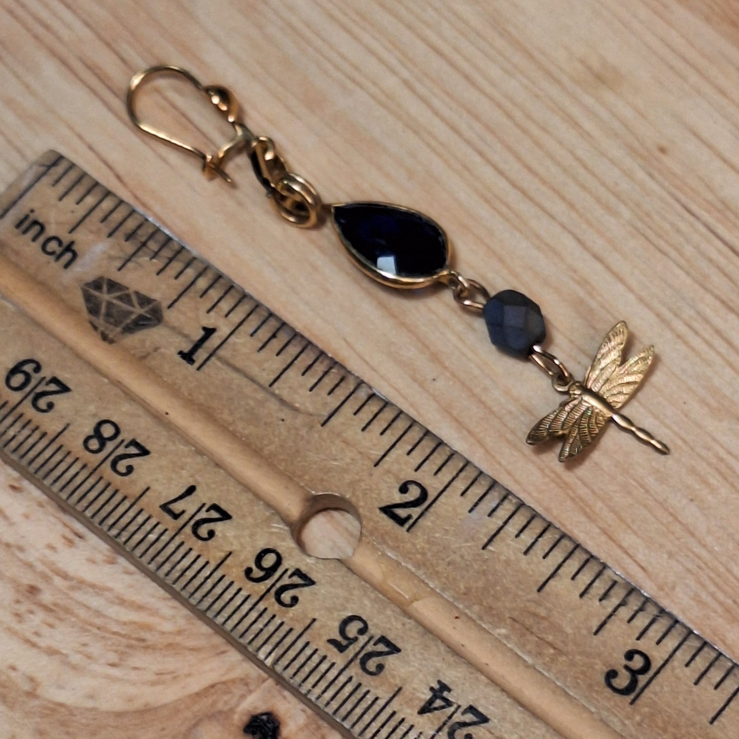 Antique gold dragonfly charm and blue sapphire art deco earrings.