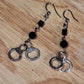 The Misdemeanor.  Silver handcuff and black bead dangle earrings. Ear hooks.