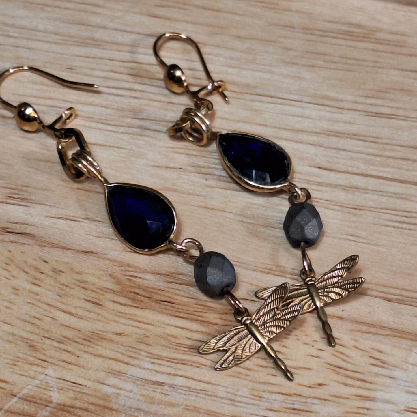 Antique gold dragonfly charm and blue sapphire art deco earrings.
