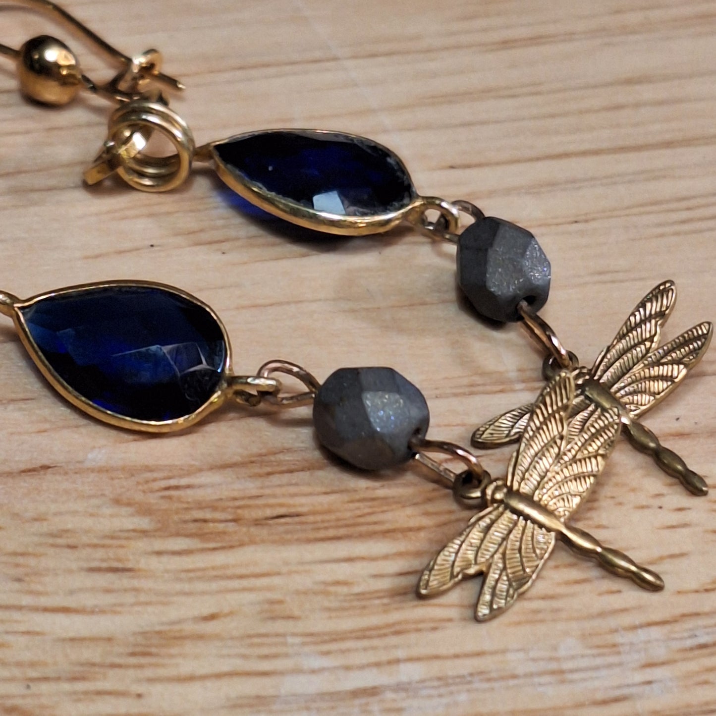 Antique gold dragonfly charm and blue sapphire art deco earrings.