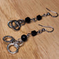 The Misdemeanor.  Silver handcuff and black bead dangle earrings. Ear hooks.