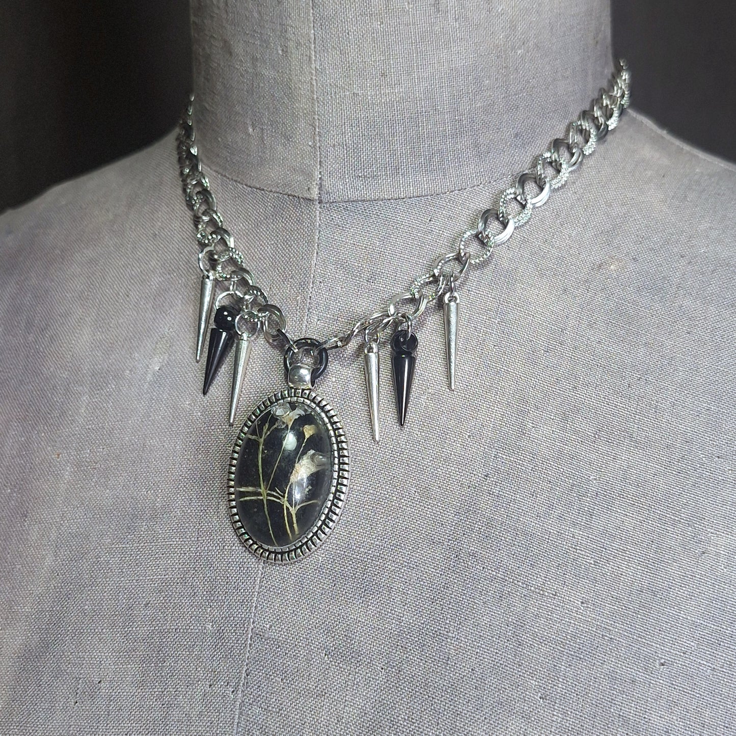 Thorny Weather. Real flower cameo pendant with a side of spikes.