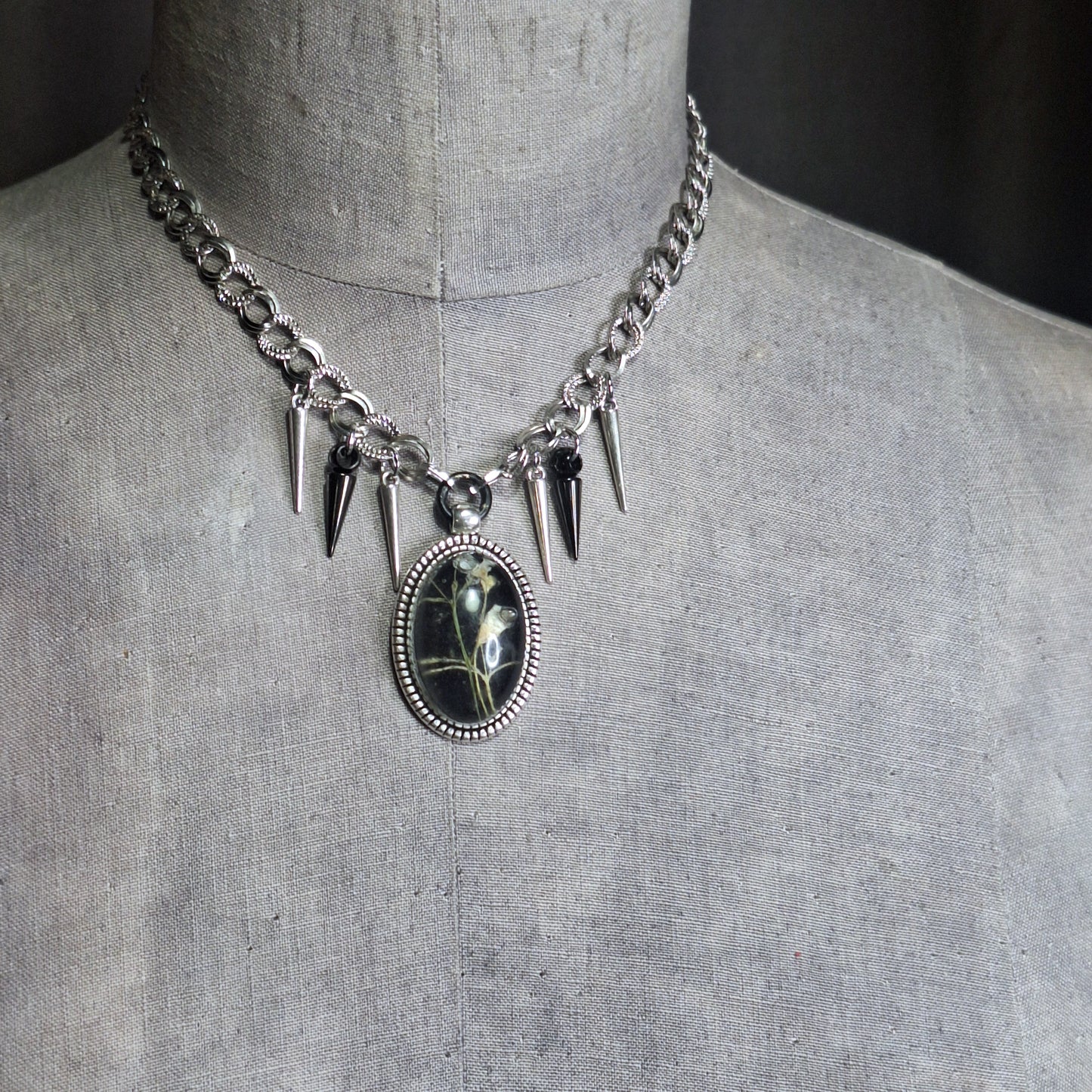 Thorny Weather. Real flower cameo pendant with a side of spikes.