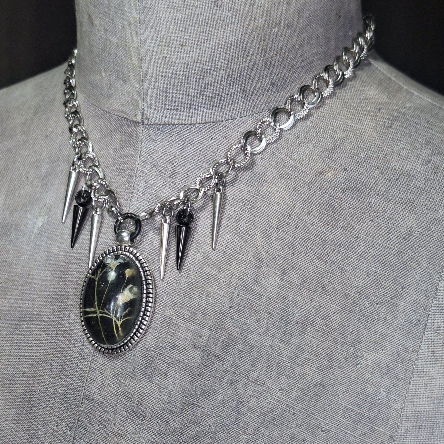 Thorny Weather. Real flower cameo pendant with a side of spikes.