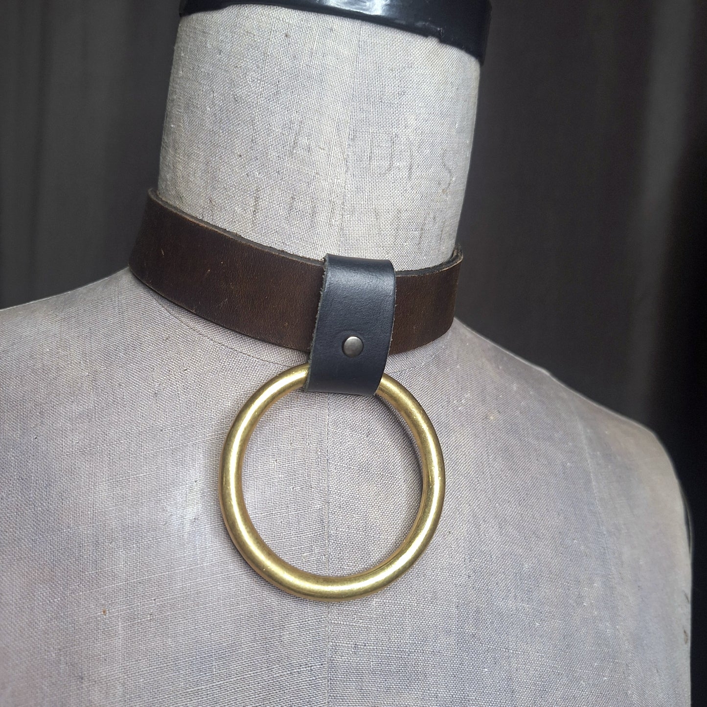 Olive leather choker with slide on 2" gold plated O-ring. Wear multiple ways. Unisex. Handmade. Adjustable buckle closure.