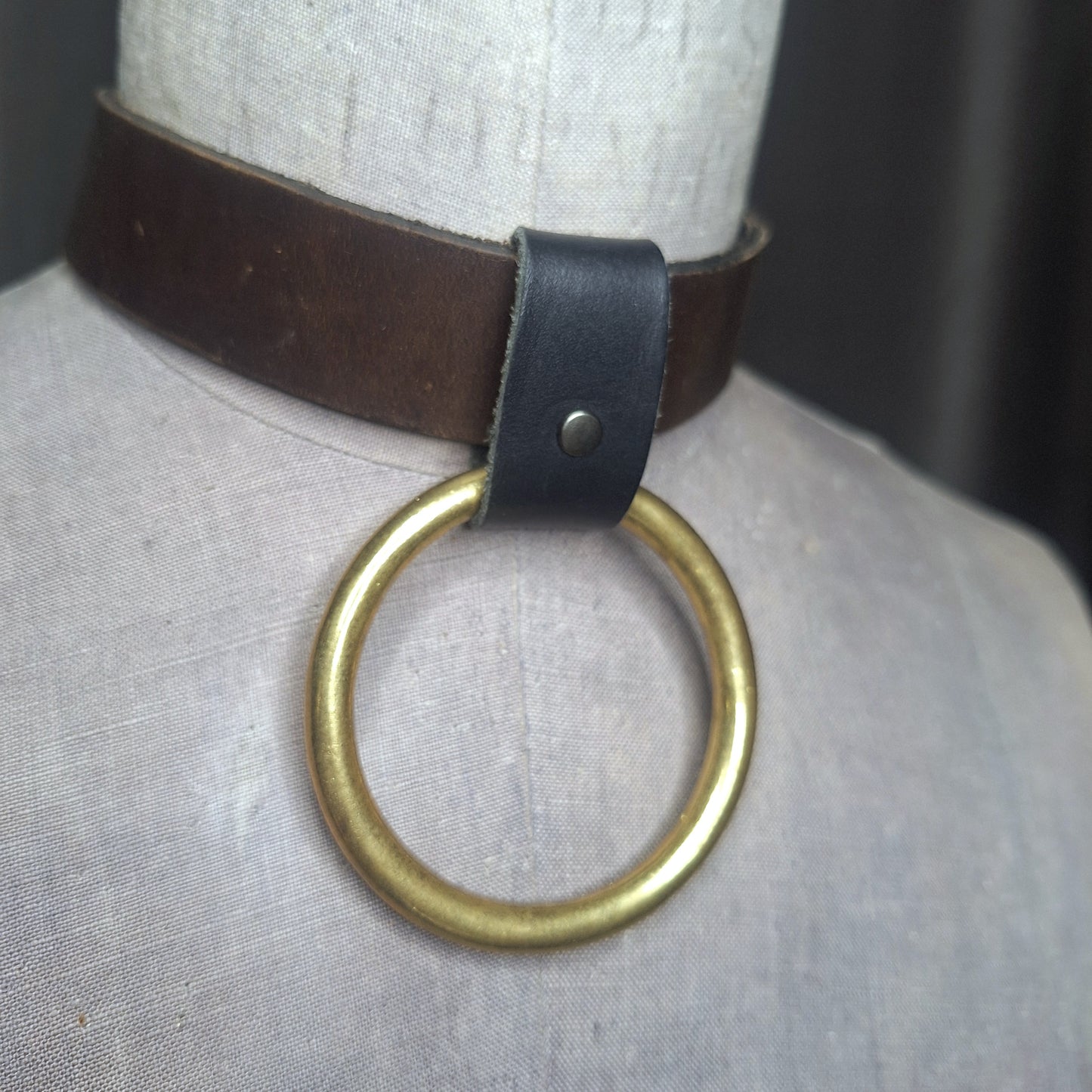 Olive leather choker with slide on 2" gold plated O-ring. Wear multiple ways. Unisex. Handmade. Adjustable buckle closure.