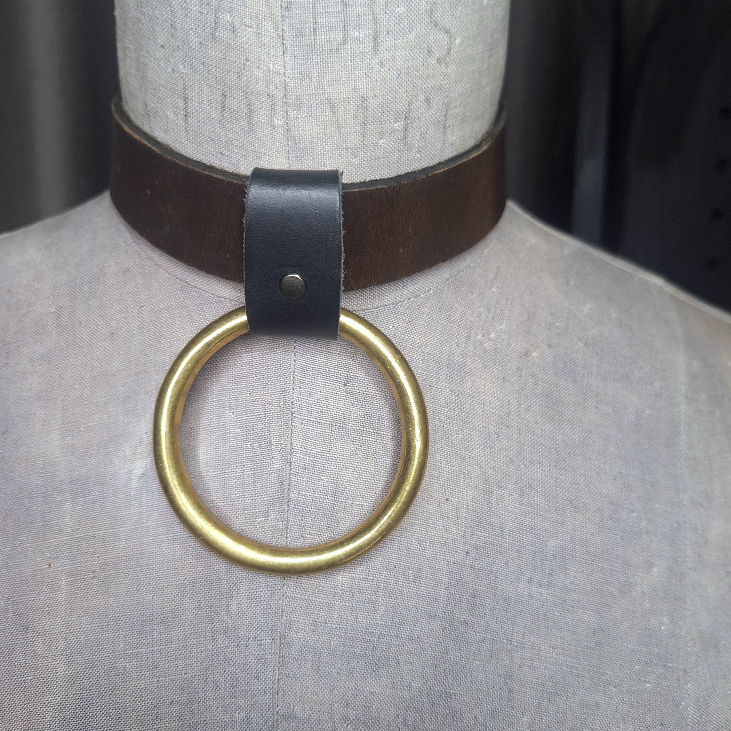 Olive leather choker with slide on 2" gold plated O-ring. Wear multiple ways. Unisex. Handmade. Adjustable buckle closure.