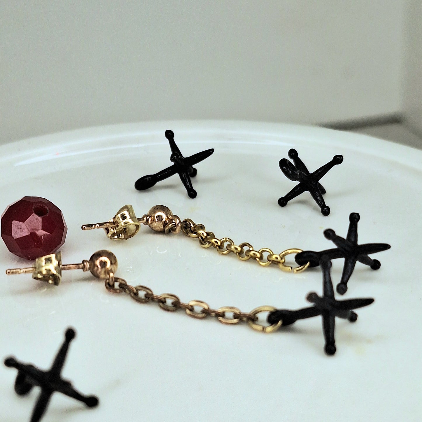 Jacks earrings. Gold chain & black jacks charms.