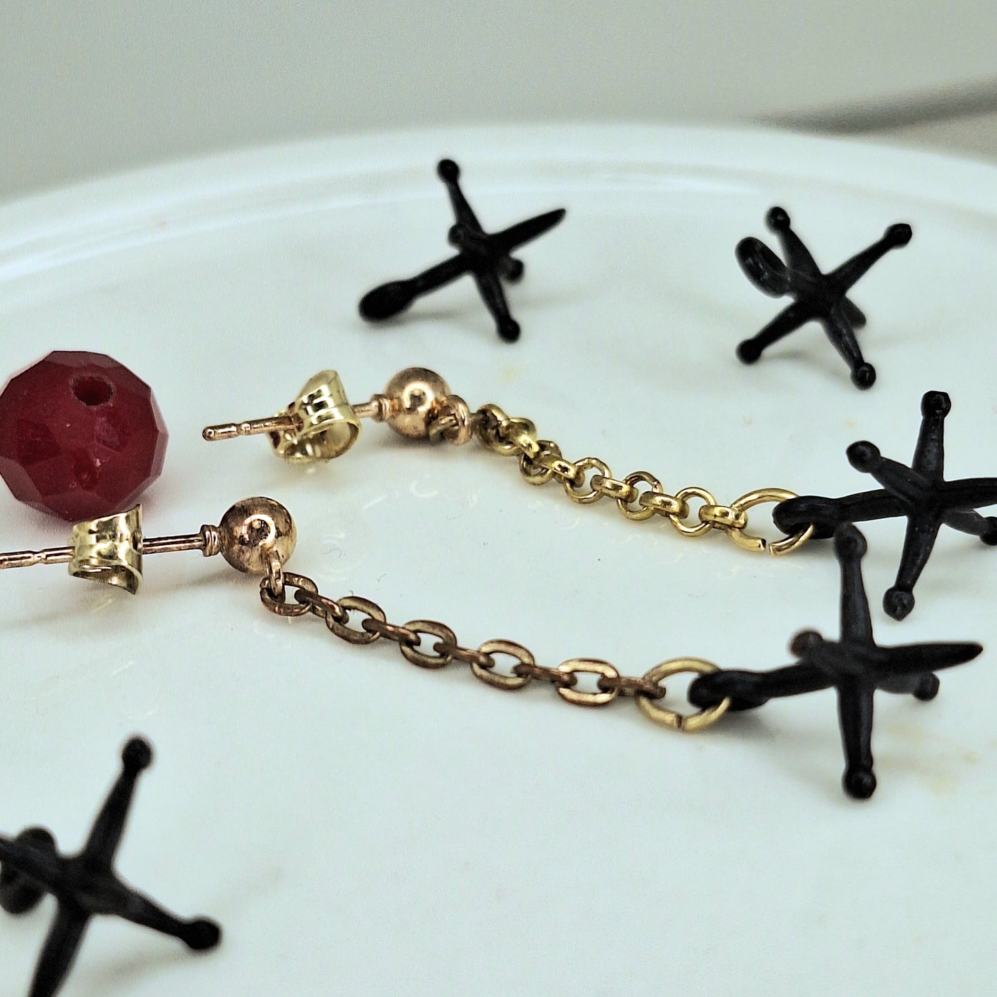 Jacks earrings. Gold chain & black jacks charms.