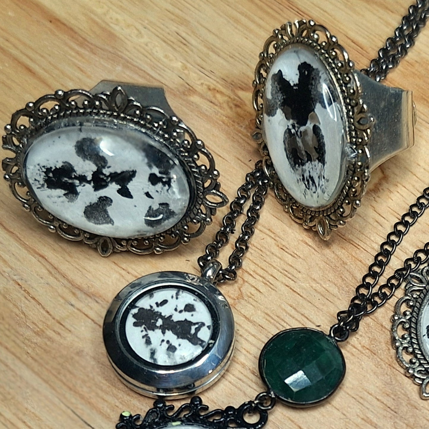 The Watchman Ink Blot Choker. Mix finishes. Antique frame, black steel O-ring.