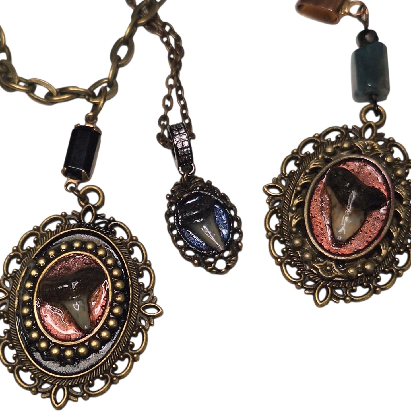 Tiny shark tooth cameo necklace. Antique layers framing. Iridescent blue backdrop.