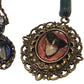 Tiny shark tooth cameo necklace. Antique layers framing. Iridescent blue backdrop.
