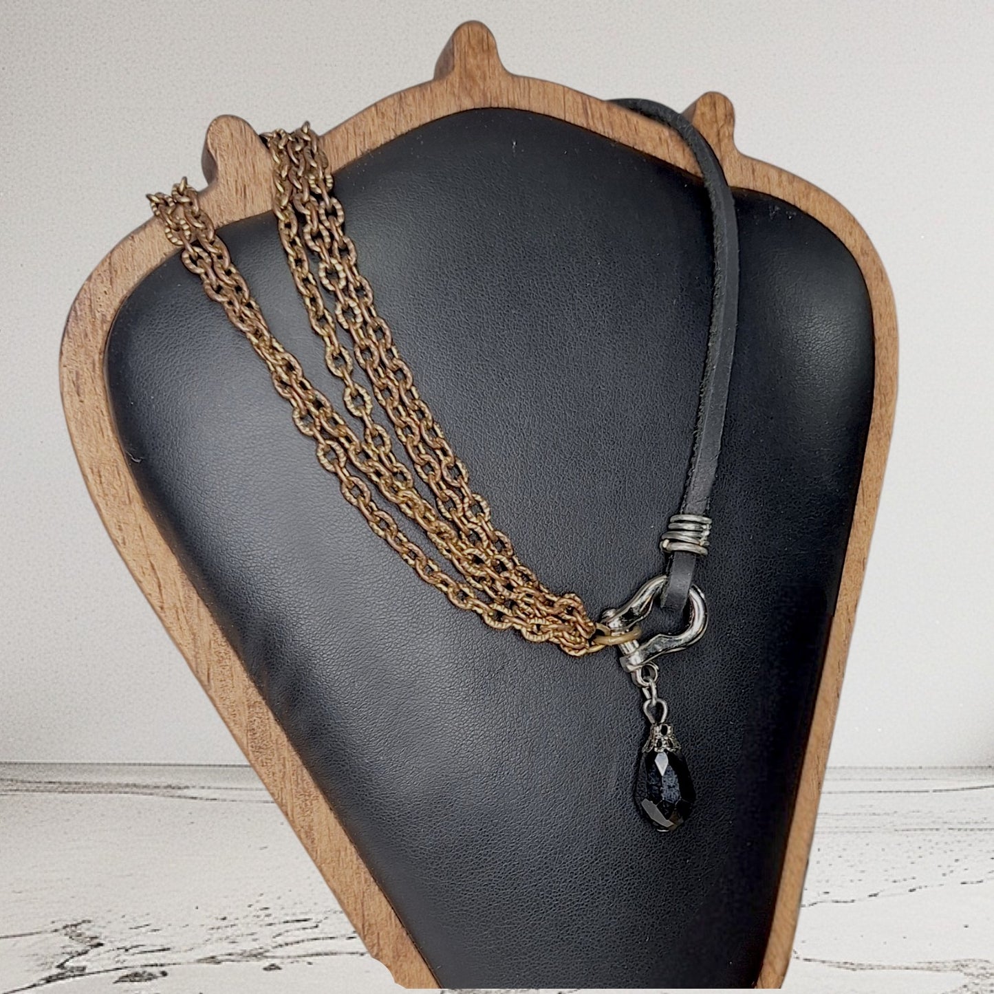 Leather and multi copper chain asymmetrical necklace. Mini silver carabiner with black teardrop crystal.