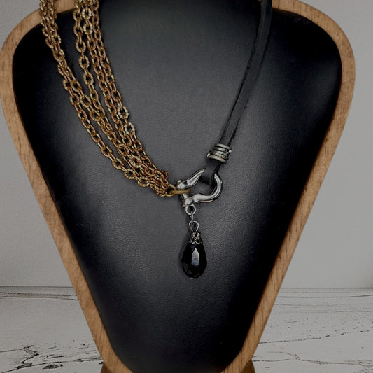 Leather and multi copper chain asymmetrical necklace. Mini silver carabiner with black teardrop crystal.
