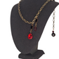 The Dracula. A NEW version of the Vamp necklace. Antique chain with 2 red asymmetrical crystal blood drops.