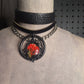 The Fire Starter. Spark your dark fem fire with this One-of-a-kind pressed flower pendant choker. Suspended in a black steel oring, off a chic black leather strip of leather. Layer it up, layer it down.