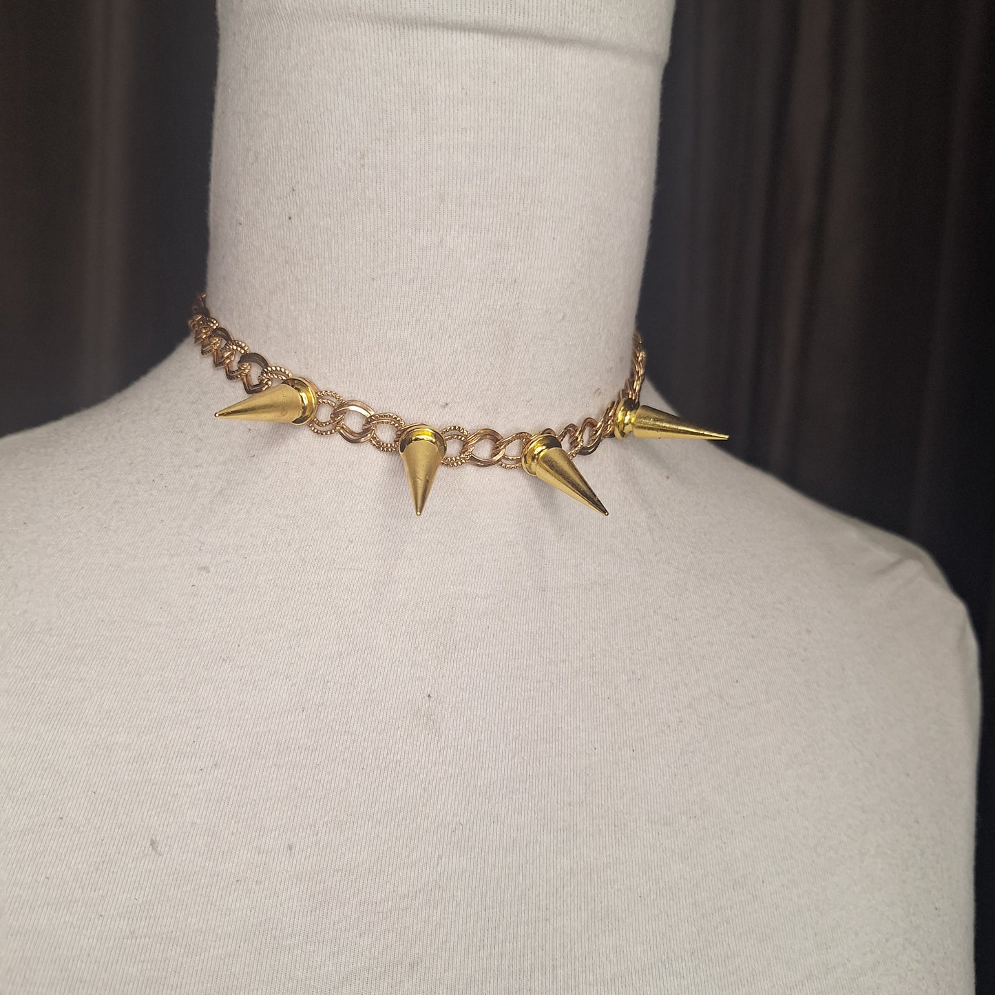 Glam Punk Gold. A spiked necklace for the sophisticated punk. Adjustable chain closure.