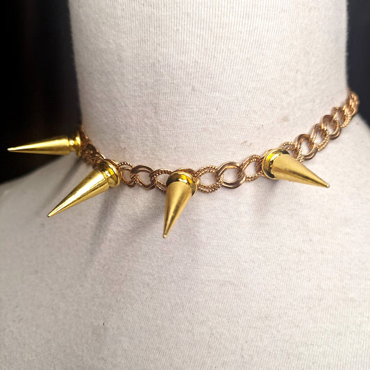 Glam Punk Gold. A spiked necklace for the sophisticated punk. Adjustable chain closure.