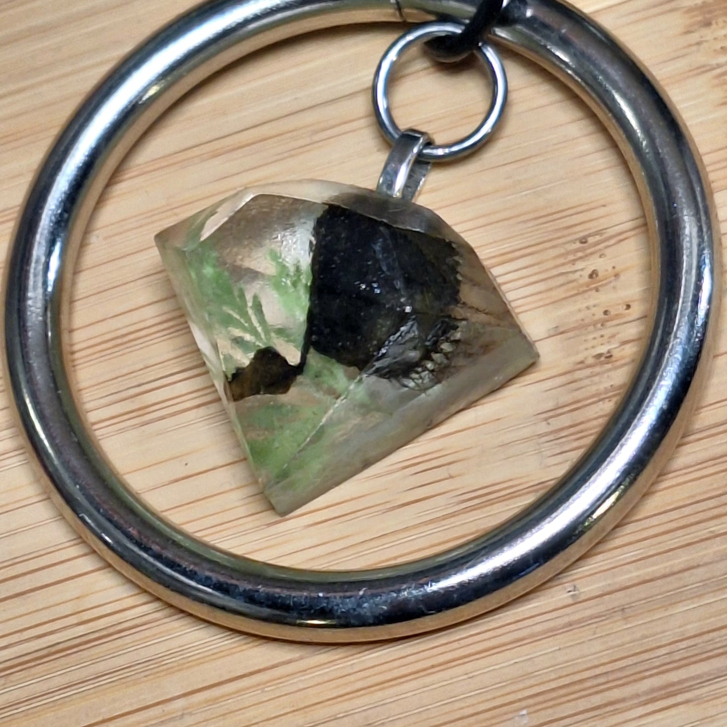 Silver O-ring leather necklace with Venus Fly Trap resin jewel pendant.