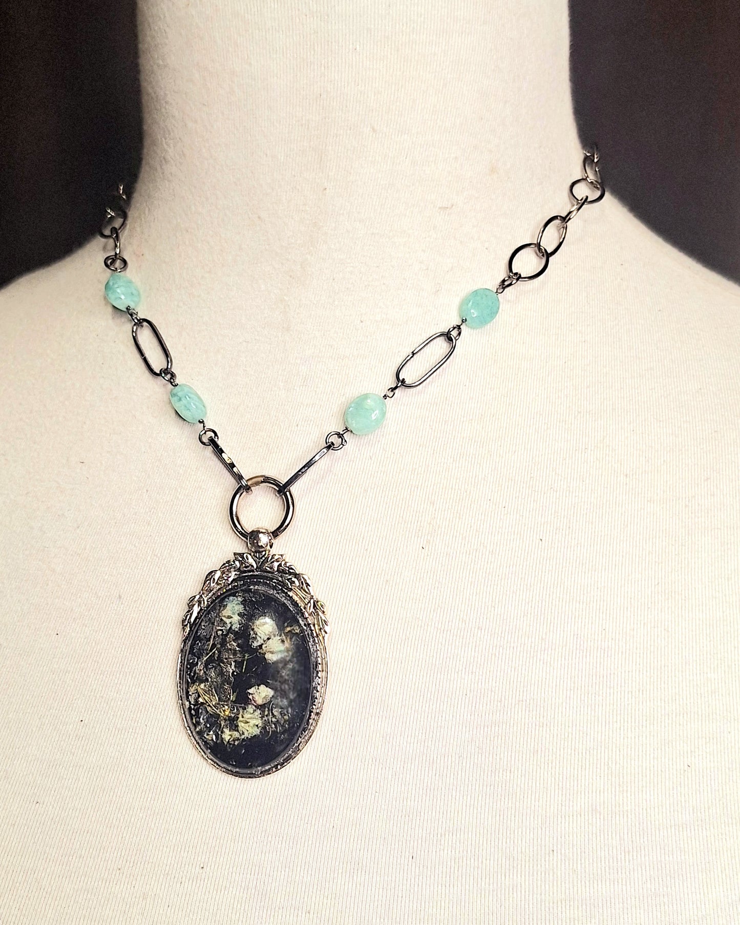 Delicate Goth Girl Pendant Necklace with babies' breath flowers in an ornate silver statement frame. Handmade. One-of-a-kind.