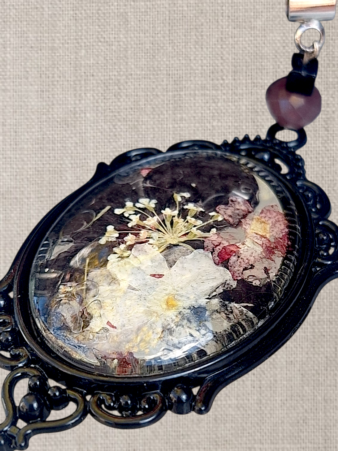 Persephone. Kinda dead, kinda alive. Statement pendant with real pressed flowers. One-of-a-kind.