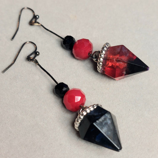 Red and black jewel shaped earrings.